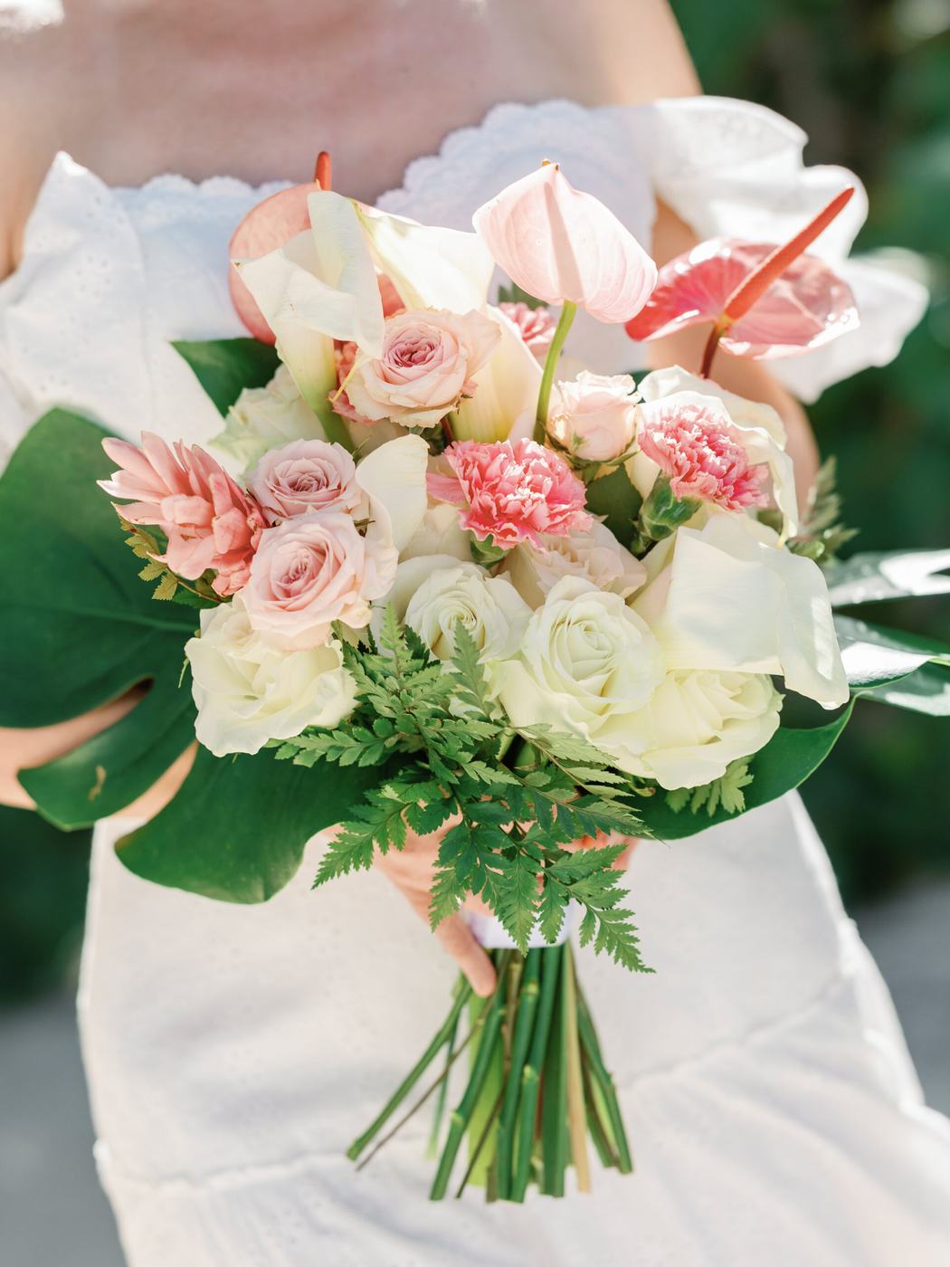 Warm-toned tropical wedding florals, terracotta and coral palette