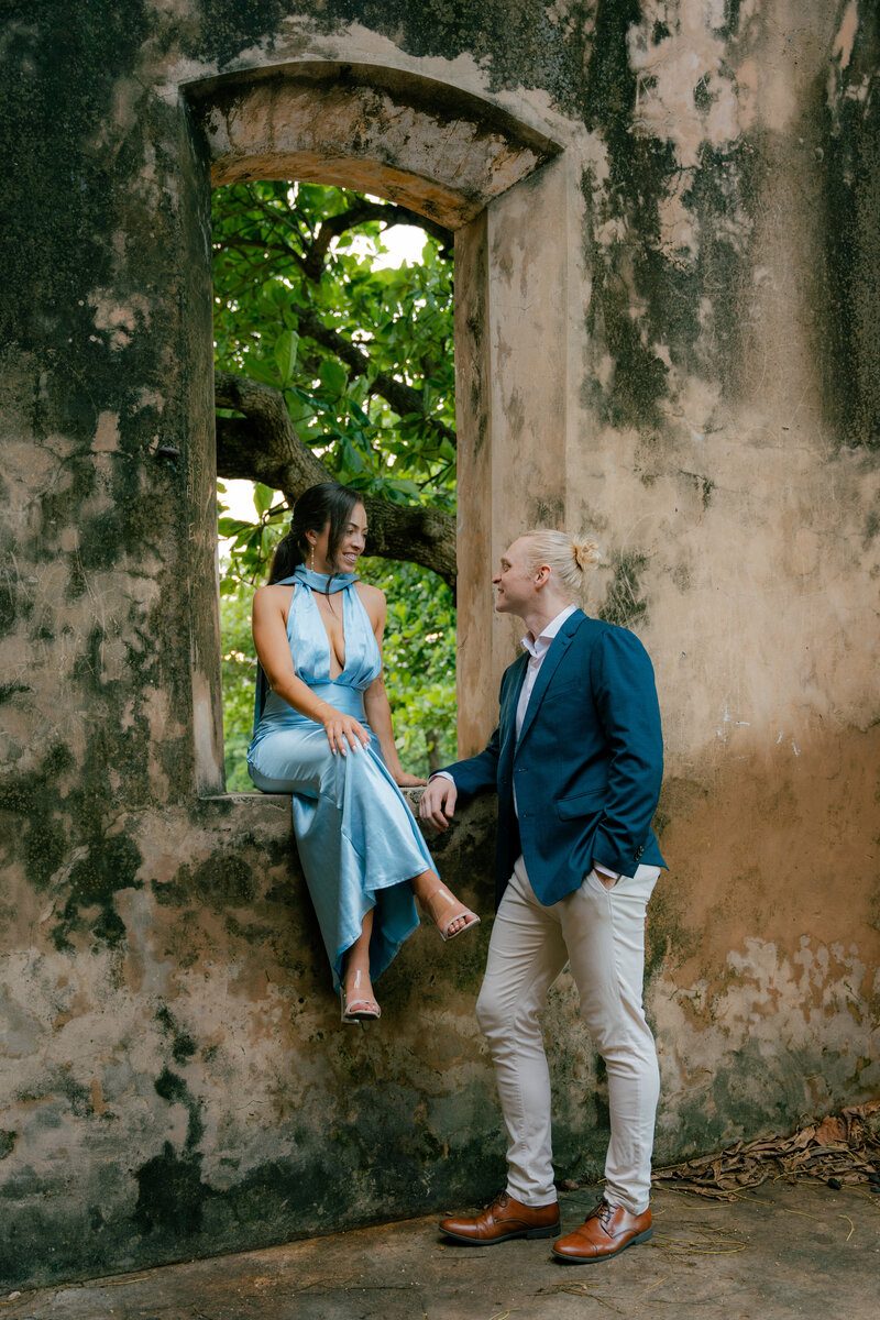 Couple among colonial stone ruins, Dominican Republic
